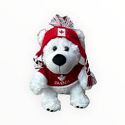 Canadian Polar Bear stuffed animal wearing sweater and toque, with Canada and maple leaf themed designed toy